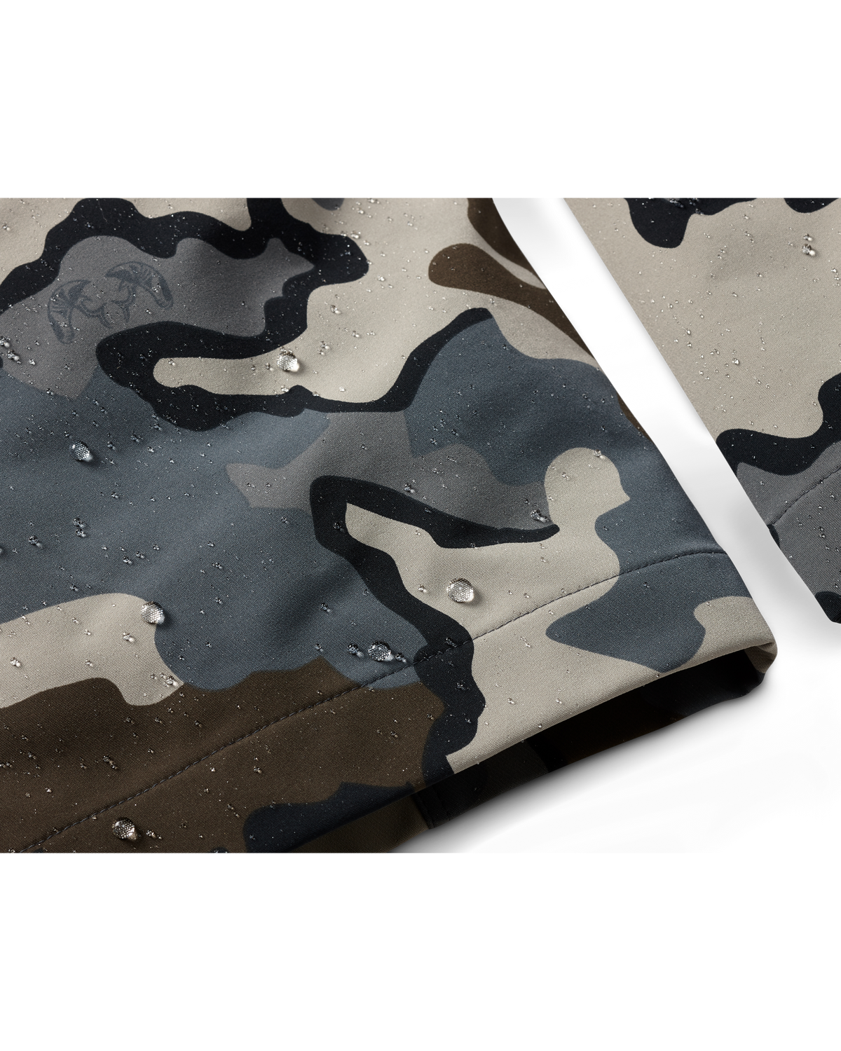 Zoomed in detail PRO Pant in Vias Camouflage showcasing water droplets on the ankle cuff